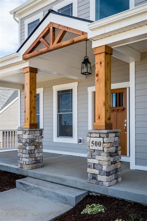 Gorgeous Front Porch! Wood and Stone Columns! | House with porch, Front porch design, Porch design