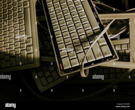 Broken keyboard inside electronic parts junk bin Stock Photo - Alamy