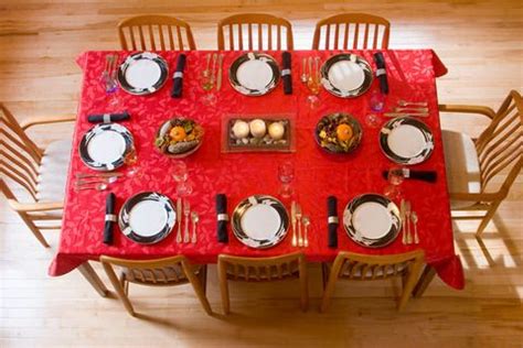 Aerial view of a dining room table set for Thanksgiving dinner, with ...