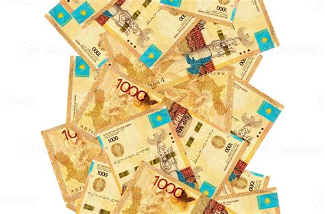 1000 Kazakhstani tenge bills flying down isolated on white. Many ...