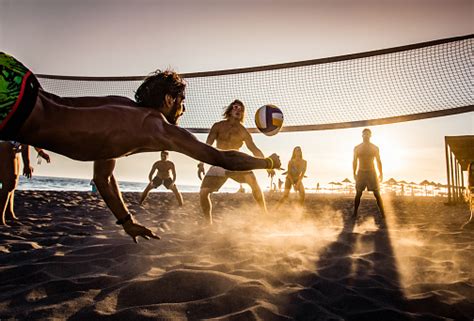 Beach Volleyball At Sunset Stock Photo - Download Image Now - iStock