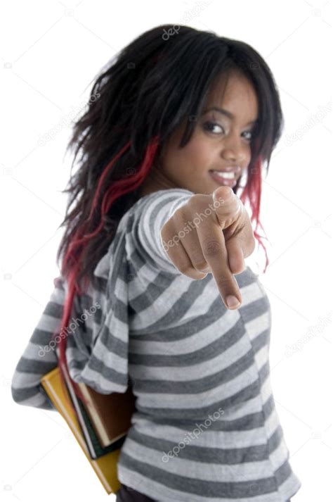 African female student with books pointing Stock Photo by ...