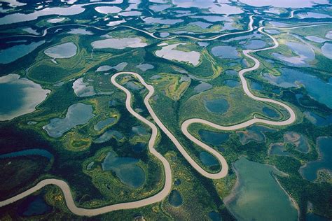 an aerial view of the water and land with many different types of riverbeds