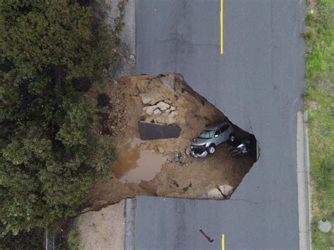 Thousands urged to flee their homes in California as death toll in recent storms rises to 16