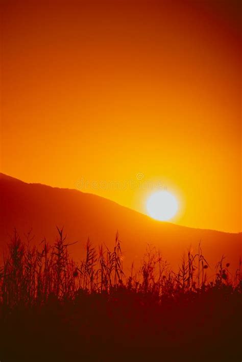 Sunrise over mountain hill stock image. Image of dawning - 111704825