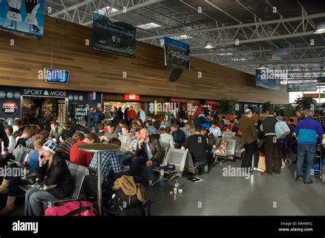 Passengers waiting in crowded departure lounge Grenoble Airport Stock Photo, Royalty Free Image ...