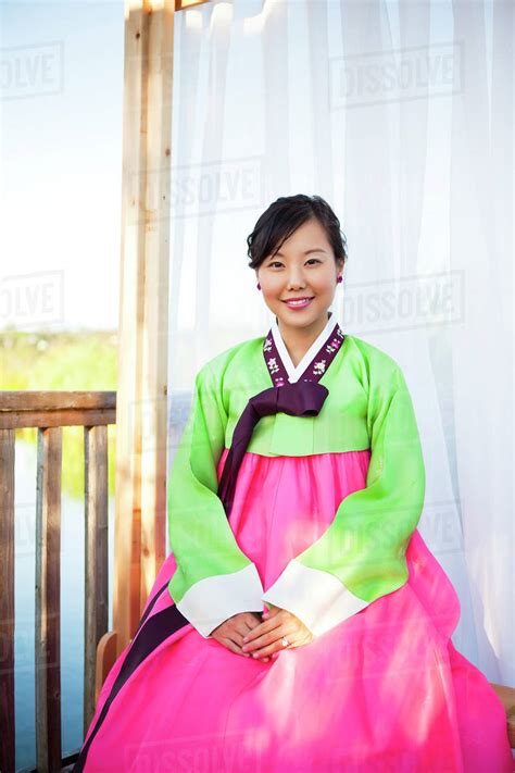 Woman in traditional Asian clothing - Stock Photo - Dissolve