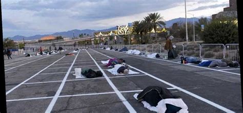 Temporary Las Vegas Homeless Shelter Has People Sleeping 6 Feet Apart in Parking Lot ...