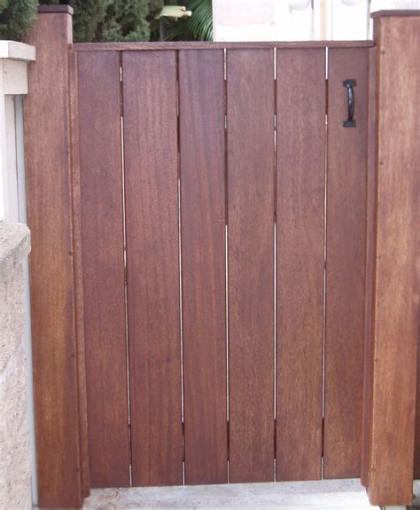 Simple gate with open boards and post caps | Wood gate, Outdoor gate ...