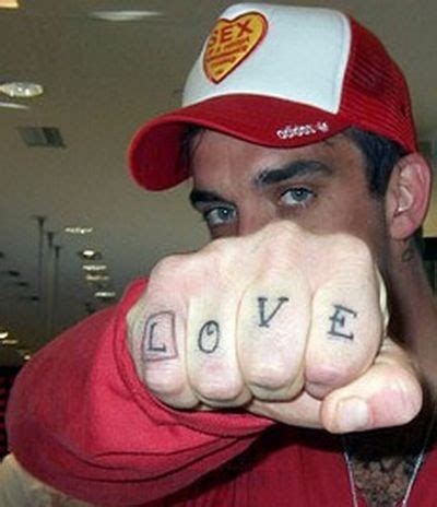 tattooed celebrity: Robbie Williams Tattoos