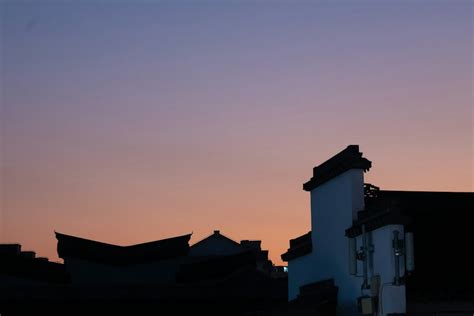 A silhouette of a building and a clock tower photo – Free Nature Image on Unsplash