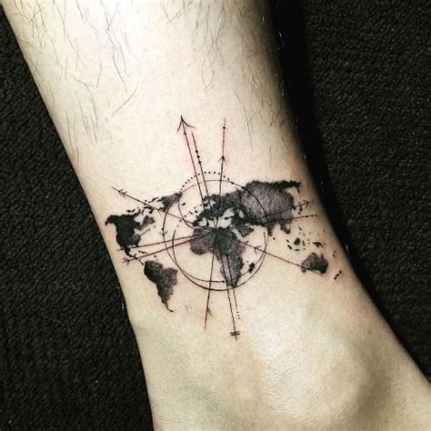 a world map tattoo on the ankle with arrows and dots around it in black ink