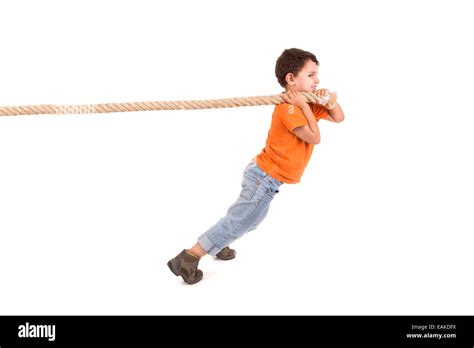 Boy pulling rope hi-res stock photography and images - Alamy