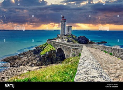 Phare petit minou lighthouse in Plouzané with dramatic clouds at the French Atlantic Coast of ...