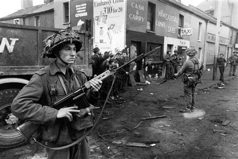 British soldiers guarding a Catholic area of Belfast with an L1A1 rifle ...