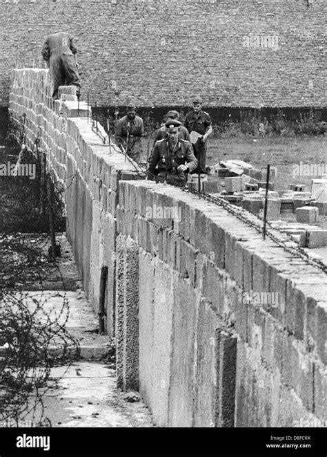 GDR policemen heightend the Berlin Wall on 09 September 1961. Armed ...