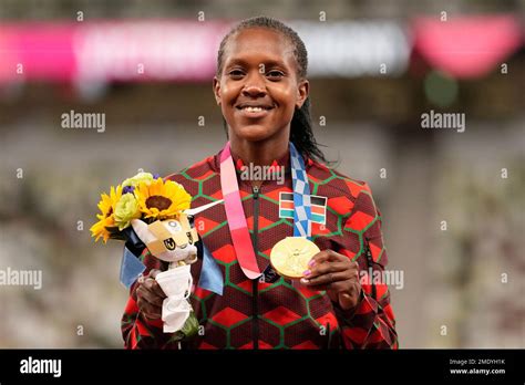 Gold medalist Faith Kipyegon, of Kenya poses during the medal ceremony for the women's 1500 ...