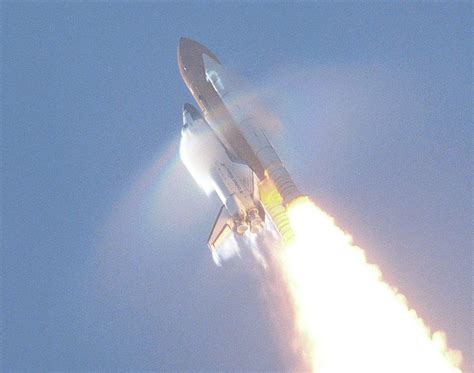 Watch a rocket launch rip a rainbow to shreds, thanks to the incredibly loud sound it produces ...