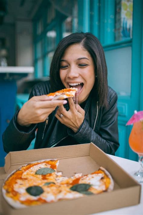 Photo of Woman Eating Pizza – GoldPoster Free Stock Photos