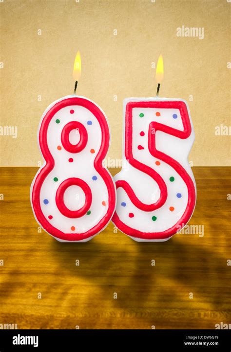 Burning birthday candles number 85 Stock Photo - Alamy