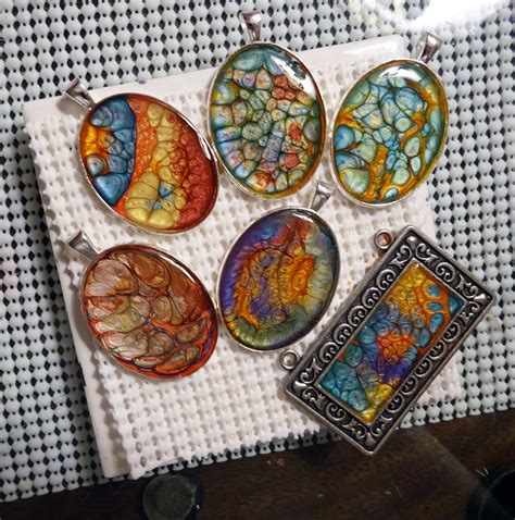 These are Pebeo paints that I did in metal pendants . Diy Resin Projects, Resin Diy, Jewelry ...