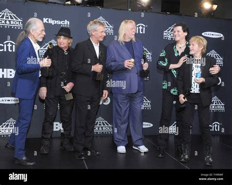 Members of the band Yes arrive in the press room at the 32nd annual ...