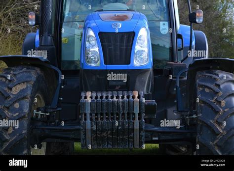 Big bright blue tractor Stock Photo - Alamy
