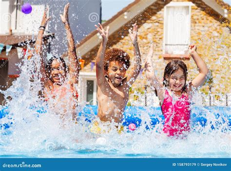 Portrait of Three Kids Splash Water in Garden Pool Stock Image - Image ...