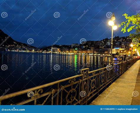 Lugano lake in switzerland stock image. Image of night - 115863095