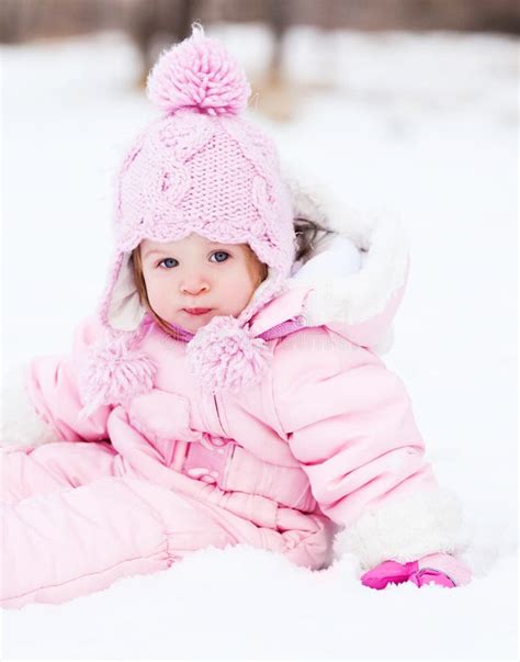 Baby on the snow stock image. Image of young, park, snowdrifts - 22309675