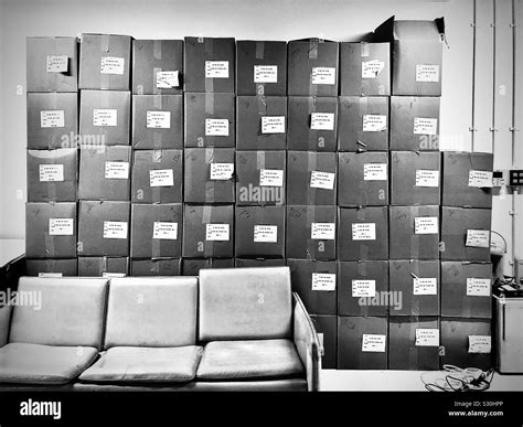 Cardboard boxes piled up for moving Stock Photo - Alamy