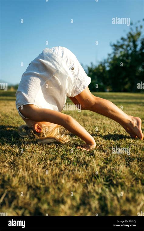 Little girl somersault hi-res stock photography and images - Alamy