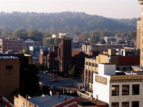 a city with tall buildings and mountains in the background