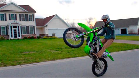 Guy Doing A Wheelie On A Dirt Bike : Kid wheelies dirt bike like a pro ...