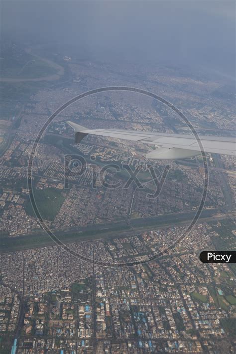 Image of aerial view of delhi through Flight window-FK624910-Picxy