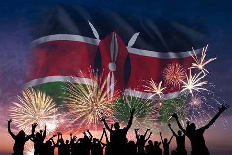 Happy people are looking holiday fireworks with flag of Kenya in sky ...