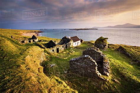 Ruins of village on Great Blasket Island, Dingle, Kerry, Ireland - Stock Photo - Dissolve