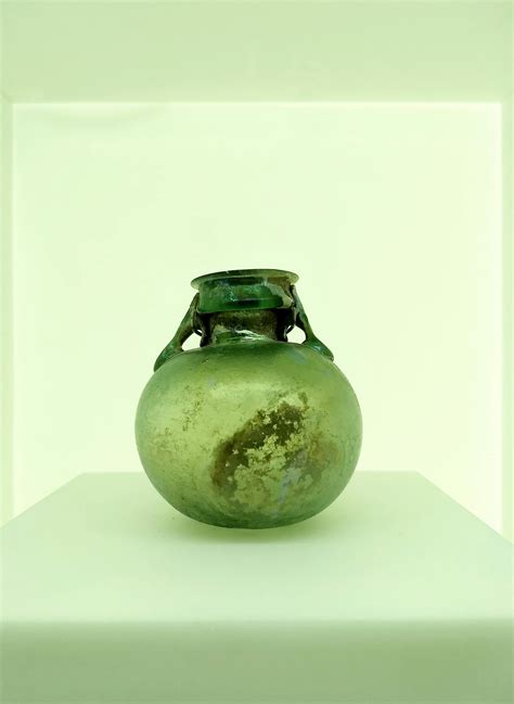 Green Glass Vase on White Surface · Free Stock Photo