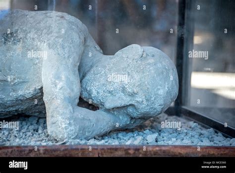 Plaster cast of man lying down in Pompeii archaeological park, one of ...