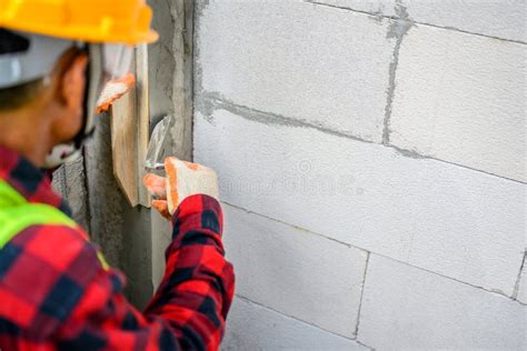 Construction Worker Plastering Lightweight Concrete Walls Plastering in Construction House ...