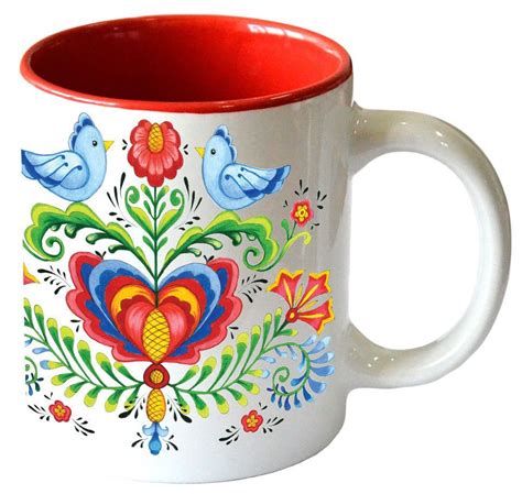 a white and red coffee mug with colorful designs on it