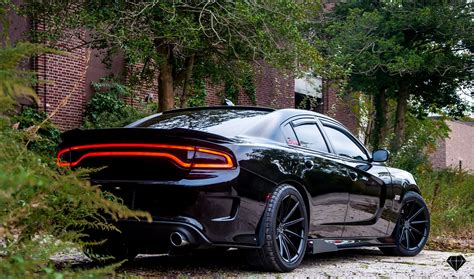 Blacked Out Dodge Charger with Contrasting Red Calipers and Accents — CARiD.com Gallery