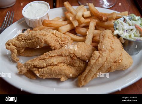 A plate of fried catfish served with French fries, coleslaw and Stock Photo: 30046785 - Alamy