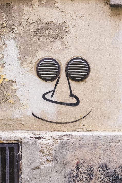 "Funny Face Graffiti With Two Small Grates As Eyes" by Stocksy ...