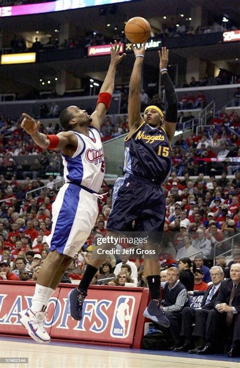 Carmelo Anthony of the Denver Nuggets puts a shot up over Cuttino ...