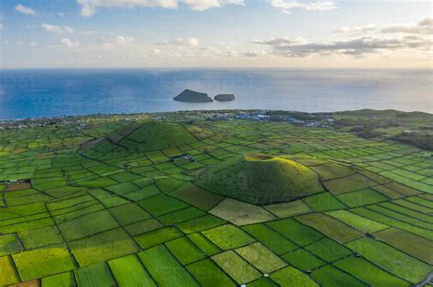 Aerial view of two volcanoes with plantation field on Terceira Island ...