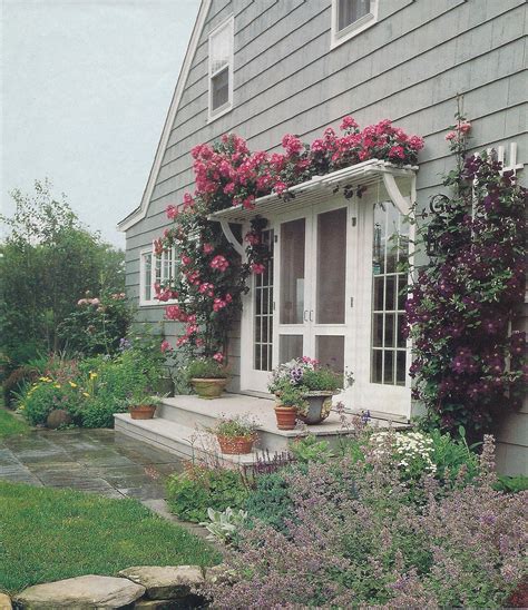 pergola with roses over french door | House Exterior | Pinterest