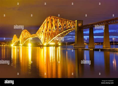 Forth Bridge, illuminated at night, near Edinburgh, Edinburgh, Scotland ...