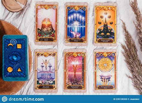 Tarot Cards Spread Face Up on White Cloth Sheet with Wooden Tray and ...