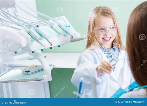 Young Female Child Girl Playing in Dentist at Dentist Office Stock ...